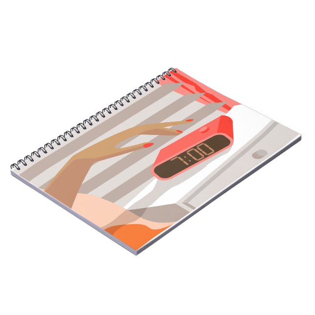 Womans hand pushing on alarm clock snooze button notebook (Left Side)