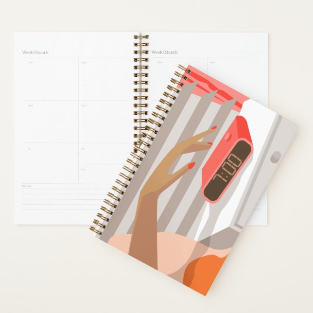 Womans hand pushing on alarm clock snooze button planner (Display)