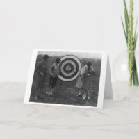 Women examining Archery Target Photograph