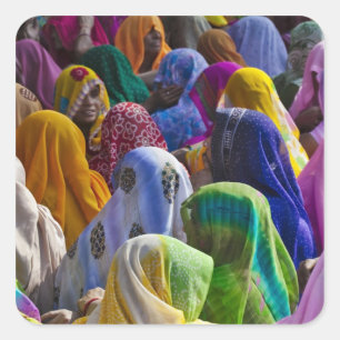 Women in colourful saris gather together square sticker