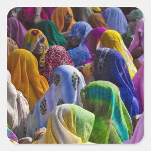 Women in colourful saris gather together square sticker