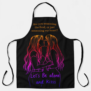 Women sharing a loving moment while wearing aprons