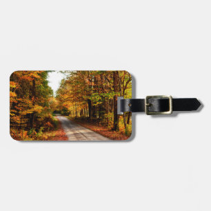 Wood trail with fall foliage luggage tag