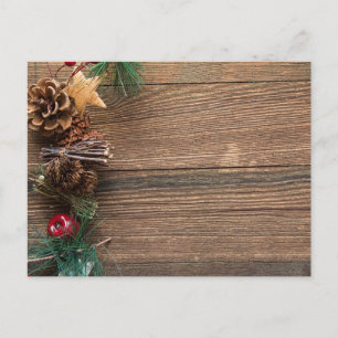 wooden background with pine cones holiday postcard