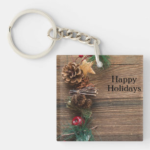 wooden background with pine cones key ring