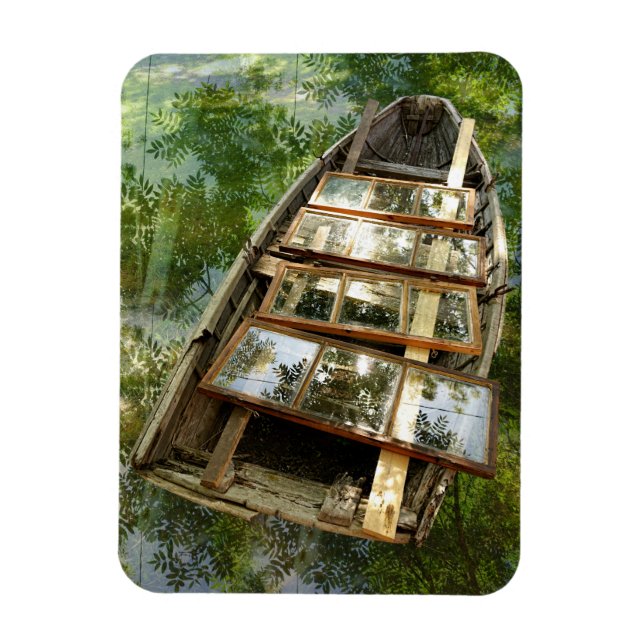 Wooden boat in a bed of rowan leaves magnet (Vertical)
