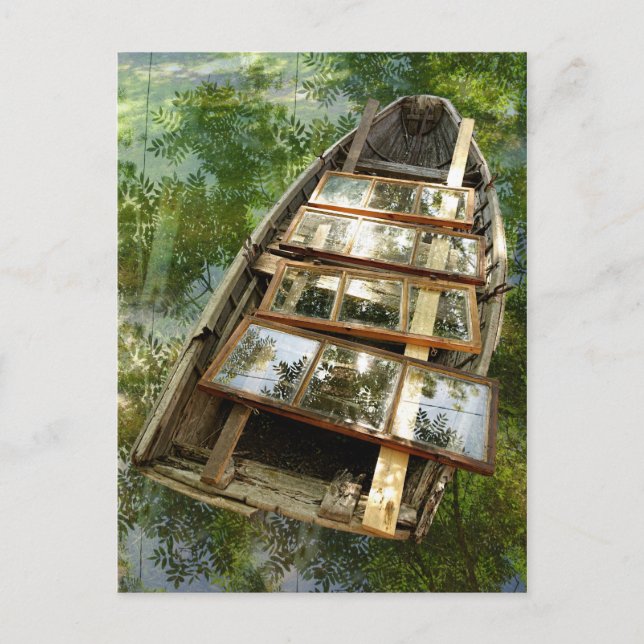 Wooden boat in a bed of rowan leaves postcard (Front)