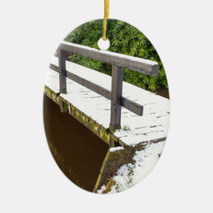 Wooden bridge covered with snow in winter ceramic tree decoration