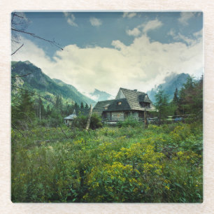 Wooden house, mountain nature scenery. glass coaster