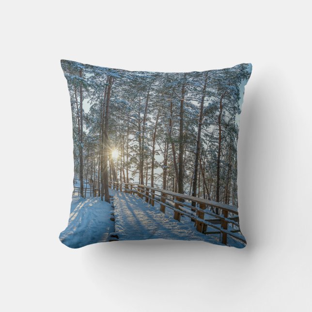 Wooden path across snowy winter forest cushion (Front)