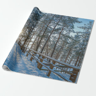 Wooden path across snowy winter forest wrapping paper