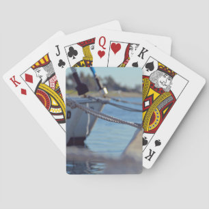 Wooden Themed, Several Boats Knotted To A Dock Wit Playing Cards