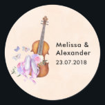 Wooden Violen & Ballet Shoes Wedding Date Classic Round Sticker<br><div class="desc">Wedding stickers with the bride and groom's name and wedding date with a feminine design. Illustrated with a watercolor image of a wooden violin, some pink ballet slippers resting against it and decorated with flowers and butterflies. Set on a peach pink coloured background. Personalise with the bride and groom's names...</div>