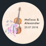 Wooden Violen & Ballet Shoes Wedding Date Classic Round Sticker<br><div class="desc">Wedding stickers with the bride and groom's name and wedding date with a feminine design. Illustrated with a watercolor image of a wooden violin, some pink ballet slippers resting against it and decorated with flowers and butterflies. Set on a peach pink coloured background. Personalise with the bride and groom's names...</div>