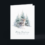 Woodland Pine Forest Wolf Merry Christmas Folded Holiday Card<br><div class="desc">A baby wolf is nestled in a winter pine forest. Merry Christmas is written in a simple script below, with an additional line below to customise the measure further. All of the text on this card can be edited. There is a Christmas message for you to personalise on the back....</div>