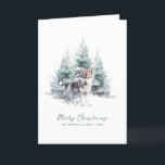 Woodland Pine Forest Wolf Merry Christmas Folded Holiday Card<br><div class="desc">A baby wolf is nestled in a winter pine forest. Merry Christmas is written in a simple script below, with an additional line below to customise the measure further. All of the text on this card can be edited. There is a Christmas message for you to personalise on the back....</div>