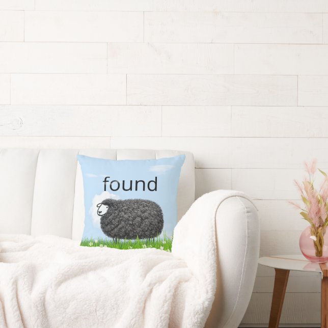 Wooly Black Sheep In Grass with "Found" Text Cushion (Couch)