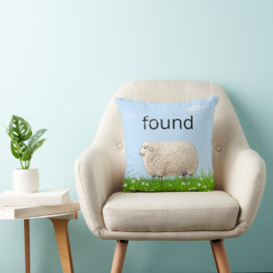 Wooly Sheep In Grass with "Found" Text Cushion