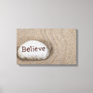 word Believe on beach rock Canvas Print