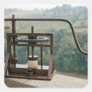 Working model of an olive press square sticker