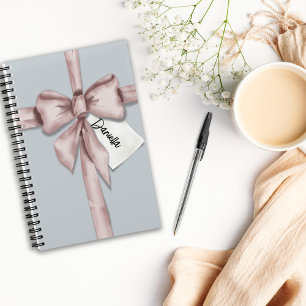 Wrapped in a pink bow notebook