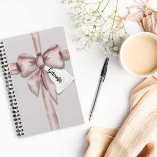Wrapped in a pink bow notebook