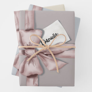 Wrapped in a pink bow wrapping paper sheet
