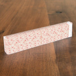 Wrapping paper with a repeating pattern of red, or nameplate