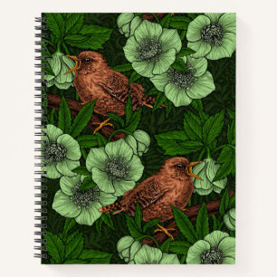 Wren and hellebore on dark green notebook