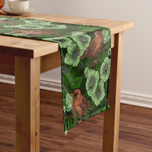 Wren and hellebore on dark green short table runner (In Situ)