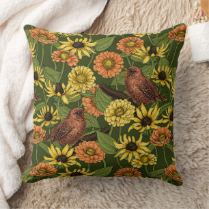 Wrens and flowers on green cushion