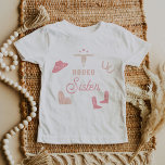 WYNONA Blush Pink Cowgirl Rodeo Sister T-Shirt<br><div class="desc">This toddler t shirt features cute blush pink cowgirl graphics and the words 'rodeo sister' in a sweet rodeo font combination. This sister shirt is the perfect gift for your favourite sis as a pregnancy announcement or works great with the first rodeo themed birthday Wynona Collection.</div>
