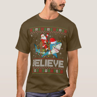 Xmas Lights Shark Believe Ugly Santa Riding Shark T-Shirt