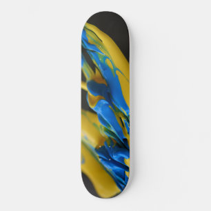 Yellow and blue paint on black skateboard
