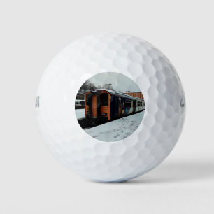Yellow and blue train golf balls