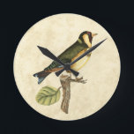 Yellow and Green Bird Perched on a Little Branch Round Clock<br><div class="desc">This engraved-inspired print displays sharp,  vivid images with a high degree of colour accuracy. The neutral background helps emphasise the colours of the bird. Customise your favourite Zazzle product using this beautiful image.</div>