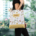 Yellow and Orange Wildflowers Tote Bag<br><div class="desc">Bring a pop of colour and a touch of summer to your daily routine with this pretty wildflower tote bag. Featuring an all over watercolor yellow and orange wildflower print, this tote is the perfect accessory for any season. Great for carrying your everyday essentials, such as books, laptop, or shopping...</div>