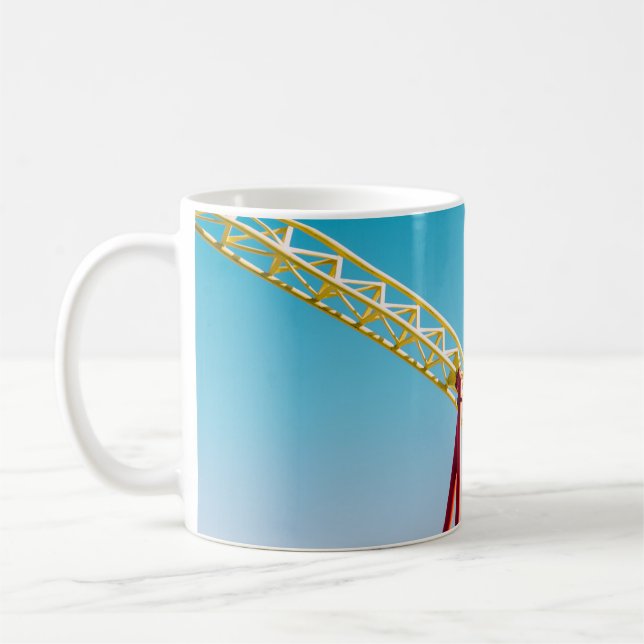 Yellow and red roller coaster under blue sky at da coffee mug (Left)