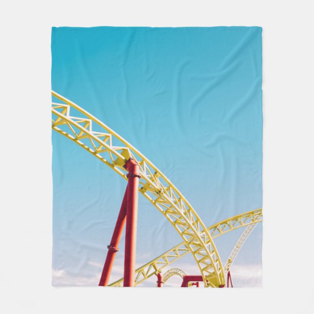 Yellow and red roller coaster under blue sky at da fleece blanket (Front)
