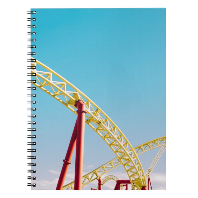 Yellow and red roller coaster under blue sky at da notebook (Front)