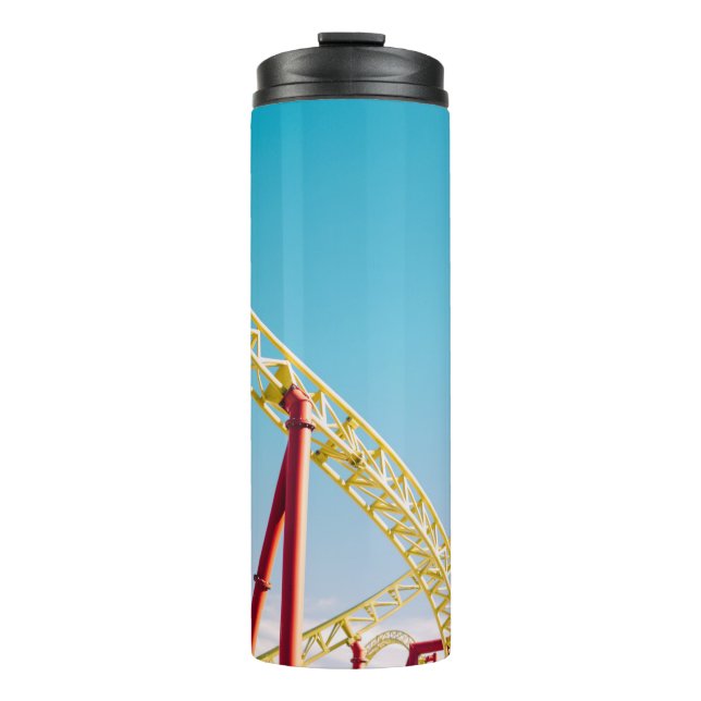 Yellow and red roller coaster under blue sky at da thermal tumbler (Front)