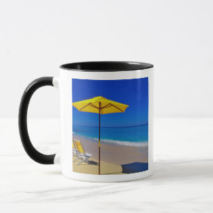 Yellow beach umbrella and chairs on pristine mug