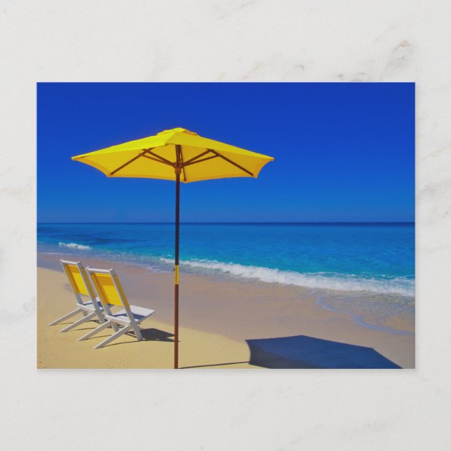 Yellow beach umbrella and chairs on pristine postcard (Front)