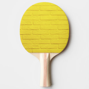 yellow brick wall ping pong paddle