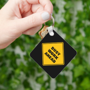 Yellow busy work ahead caution sign personalised key ring