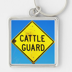 yellow cattle guard sign  blue background keychain