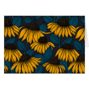 Yellow coneflowers on dark blue