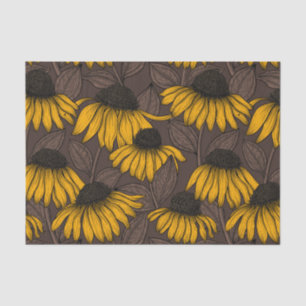 Yellow coneflowers on dark brown tissue paper