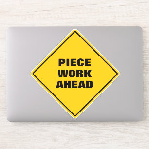 Yellow diamond road sign piece work ahead