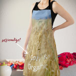 Yellow field square wall clock apron<br><div class="desc">Nature themed Apron featuring a photo of summer rural landscape. We see yellow wheat fields under the blue sky. Rustic accent to your kitchen, stylish gift for country and farmhouse style lovers. You can replace the text "Cosy & Organic" with your own message or delete it. For further modifications (font...</div>